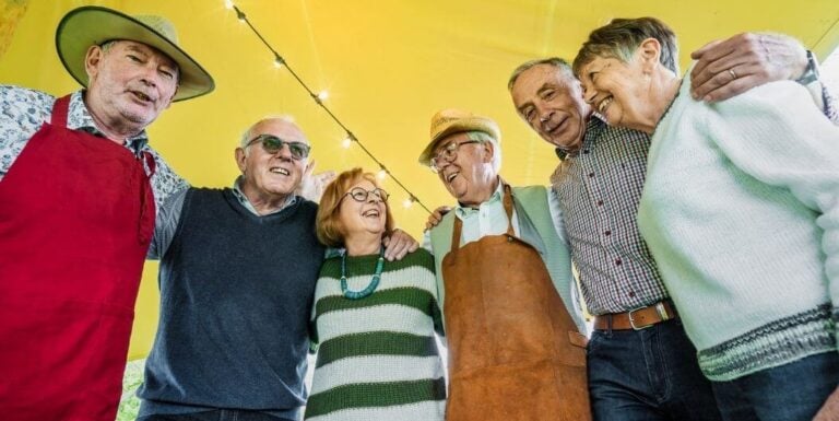 Group of Elderly Residents Enjoying Outdoor Event at Senior Living Communities
