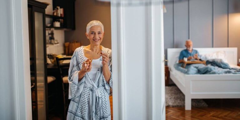 Elderly Woman Enjoys Morning Pastry in a Two-Bedroom Independent Living Apartment